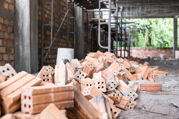 Pile of of  bricks placing in row prepared for new house construction