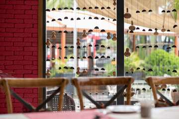 Decorated modern restaurant showing a blurred exterior and a decorated glass window
