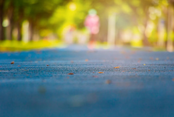  track run rubber cover blue in public park jogging exercise for health and blur people runner. select focus with shallow depth of field