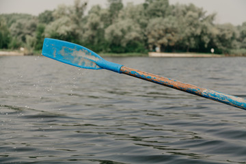 Paddle with plastic paddle above  water