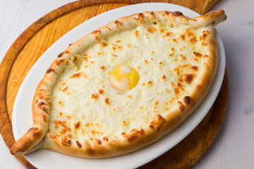Adjarian Khachapuri with cheese sulguni - Georgian cuisine. Top view