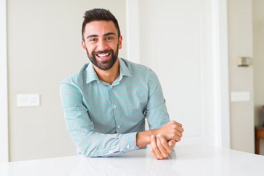 Handsome man smiling cheerful with a big smile on face showing teeth, positive and happy expression
