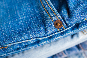 denim blue jeans stack texture background closeup