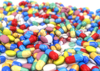 Fototapeta na wymiar Different pills and capsules placed on a table, with low depth of field