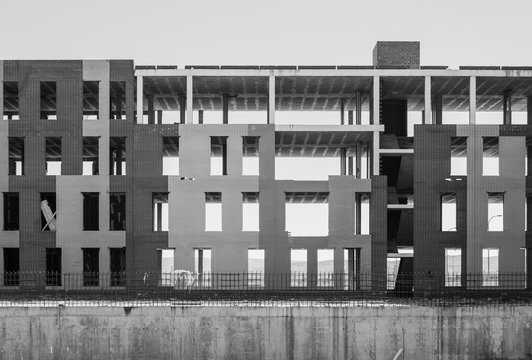 Unfinished construction site with erected concrete frame of building