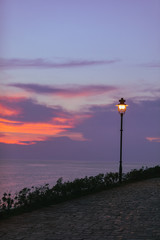 park view with city lights lamps sea on background in rovinj city in croatia