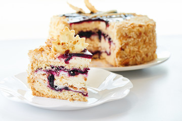 Appetizing berry cake on a white plate. Homemade pastries, sweet dessert for the holiday