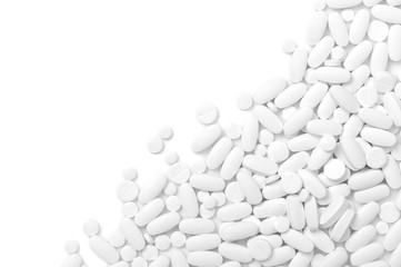 White pills (tablets) background.