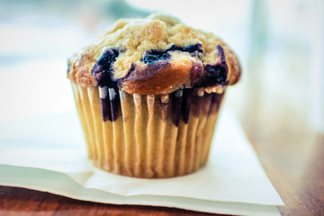 Fresh blueberry muffin on napkin
