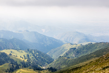 Naklejka premium Mountain valley in summer, Almaty, Kazakhstan. View from the mountain peak Kumbel