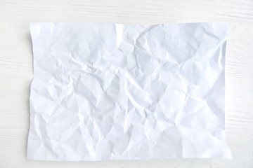 crumpled paper on white background for design banner or card, selective focus. Clear textured page...