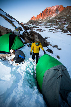 Alpine climbers Marko Pujic (left), Pete Tapley (top) and Craig Pope set up base camp in the Titcomb Lakes basin in the Wind River Range in Wyoming.      