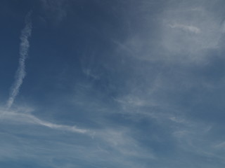 Thin clouds on a bright blue sky. 