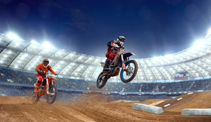 Motocross riders in action. Supercross. Motocross sport.