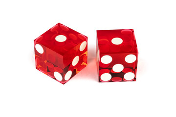Two red glass luxury dices isolated against a white background. One and one with shadow, full clipping. Macro shooting, selective focus.