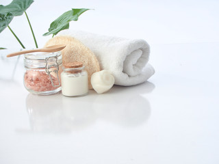 Set of spa accessories on a white table