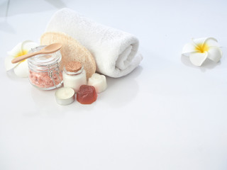 Set of spa accessories on a white table