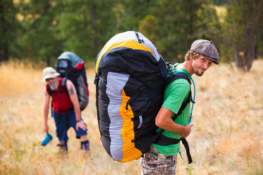 Father and son. Darrell (left) and Nathan Anglen pause during their hike up Paradise Ridge for a paragliding outing near Moscow, Idaho.