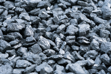 The texture of coal. Mining of coal. Hardened wood. Natural black coals for background, coal industry. 