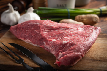 raw tri tip steak beef on wooden cutting board - obrazy, fototapety, plakaty