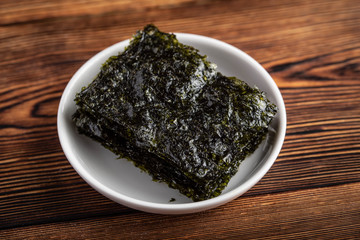 korean roasted seaweed on wooden background