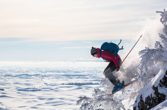 Side view of man skiing on snowy landscape