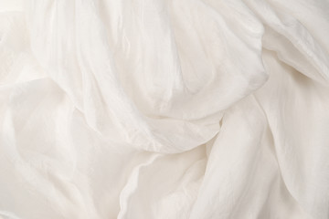 Soft smooth white silk fabric background. Fabric texture.