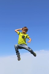 Fototapeta na wymiar Boy jumps in the air