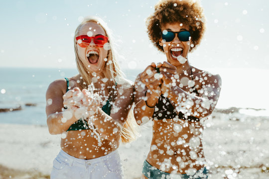 Best Friends Having Fun On Beach Holiday