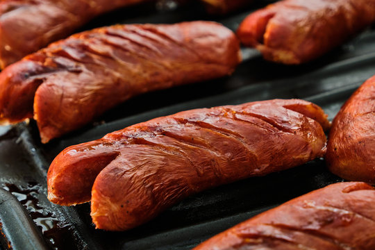 Sliced sausage on grill