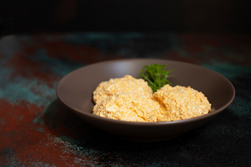 Serbian salad called Urnebes of cheese and chili peppers, paprika powder, chopped peppers and dry peppers (aleva). Traditional Serbian appetizer. Spoon with salad. Serbian cuisine. Closeup. Copy space