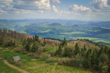 Beautiful mountain spring landscape. Picturesque valley and green hills.