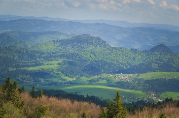 Beautiful mountain spring landscape. Picturesque valley and green hills.
