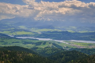 Beautiful mountain spring landscape. View of the Czorsztyn Lake and green valleys and hills.