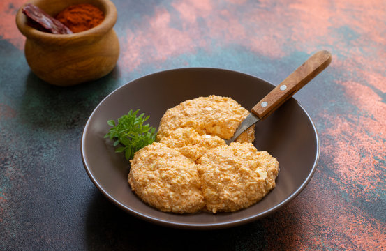 Serbian salad called Urnebes of cheese and chili peppers, paprika powder, chopped peppers and dry peppers (aleva). Traditional Serbian appetizer. Serbian cuisine