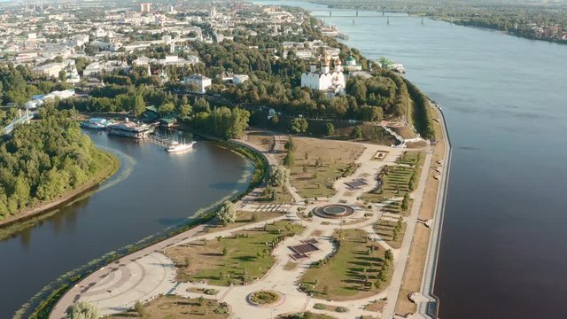 Scenic aerial view of famous Strelka park in place of confluence of Kotorosl and Volga rivers in ancient touristic historic town Yaroslavl in Russian Federation. Beautiful summer sunny look of park