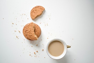 cup of coffee with almonds on white background