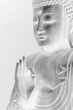 The black-and-white inverted image of Buddha.