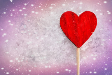 Red Love Heart. Valentine's background. Greeting card. Heart symbol against wood and snow background.