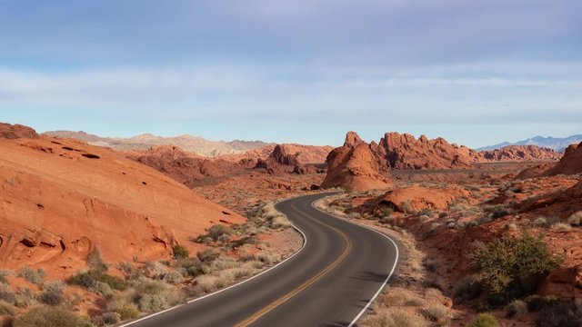 Scenic view on the road in the desert during a cloudy and sunny day. Taken in Valley of Fire State Park, Nevada, United States. Still Image Continuous Animation
