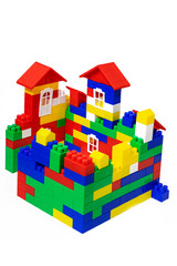 Multi-storey multi-colored house of toy plastic cubes. isolated