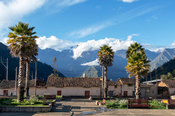 The main square of Cachora village with snow Andes mountains on the background, Peru