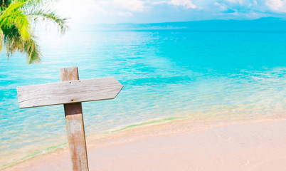 beach landscape with vintage wooden sign