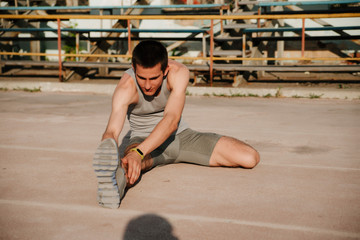The athlete warming up at the stadium