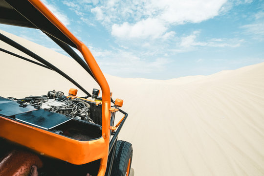 View from a sand buggy in the desert against a blue sky