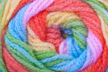 Multicolored thick yarn. Textile manufactory, interior items. Needlework, hobby, handicraft,...