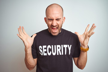 Young safeguard man wearing security uniform over isolated background celebrating mad and crazy for...
