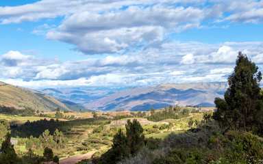 Fototapeta na wymiar Green mountain landscape with Inca ruins of fortress Puka Pukara, Cusco Region, Peru