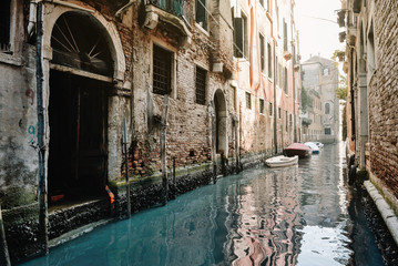 Canal with gondolas in Venice, Italy.