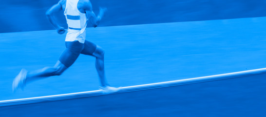 Motion blurred view of a man running
